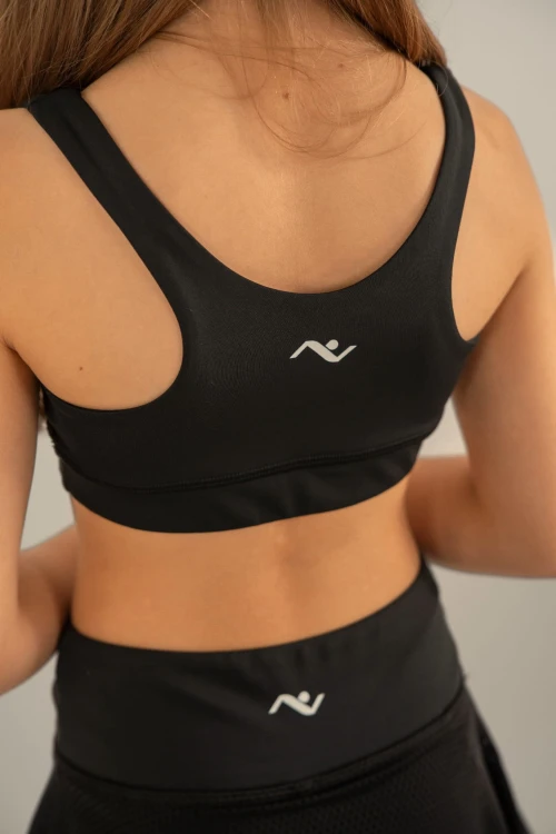 Top dziewczęcy ActiveGlow czarny - widok z tyłu w komplecie z getrami ze spódniczką